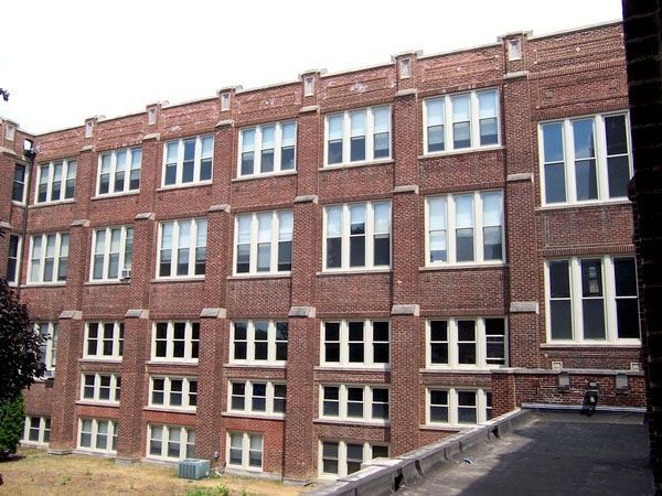 A large brick building with a lot of windows