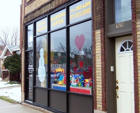 A brick building with a cleaning center on the front