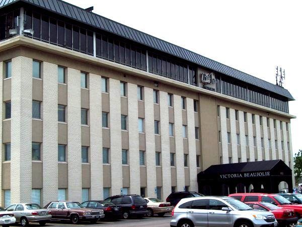 A large building with cars parked in front of it