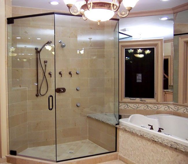 A bathroom with a walk in shower and a bathtub