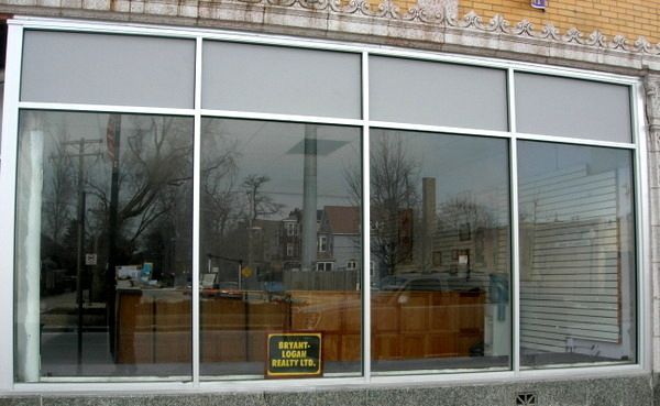 A large window with a sign that says