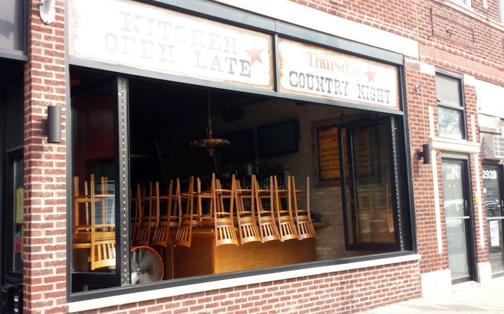 A brick building with a sign that says country night