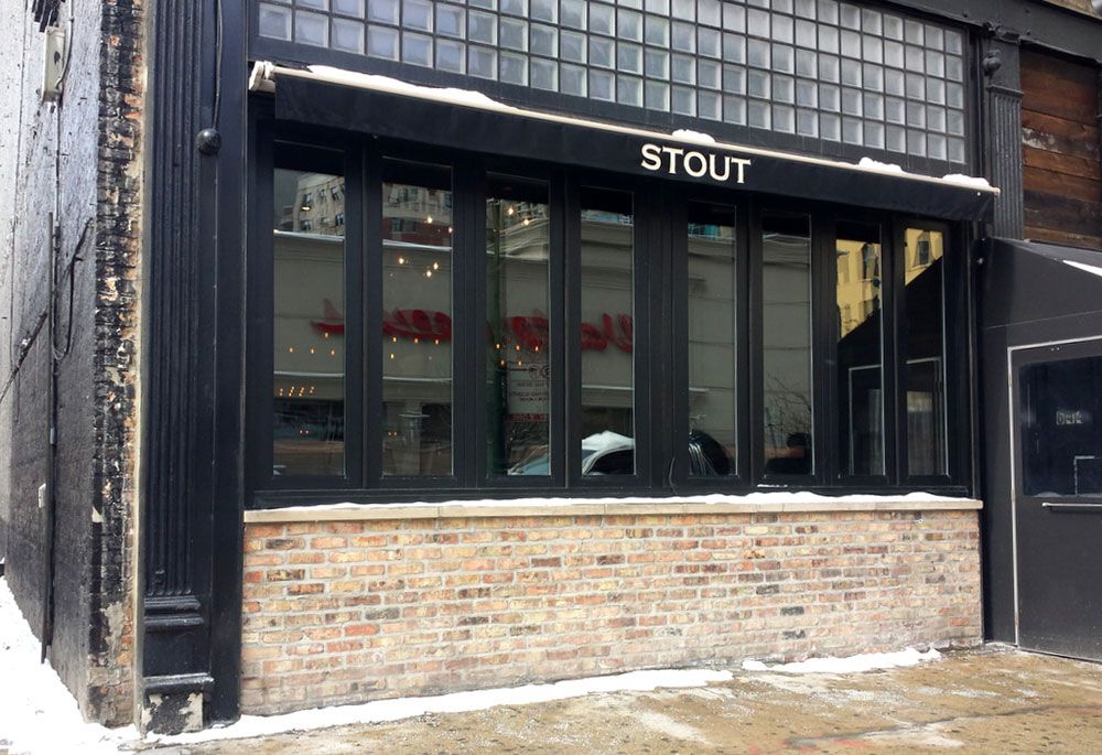 A building with a sign that says stout on it