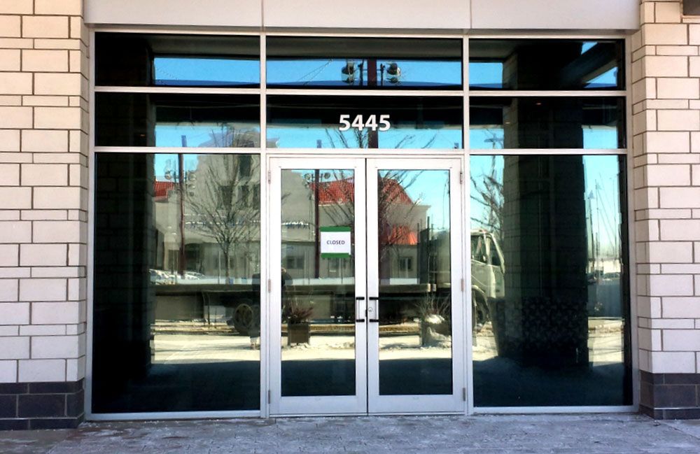 The front door of a building with the number 5445 on it