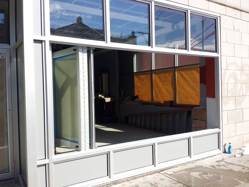 A building with a lot of windows and a brick wall