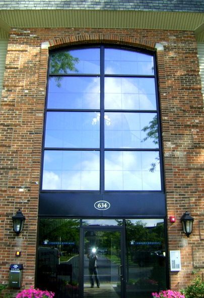 A brick building with the number 6h on it