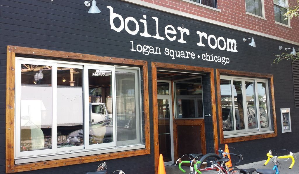 A black building with a sign that says boiler room