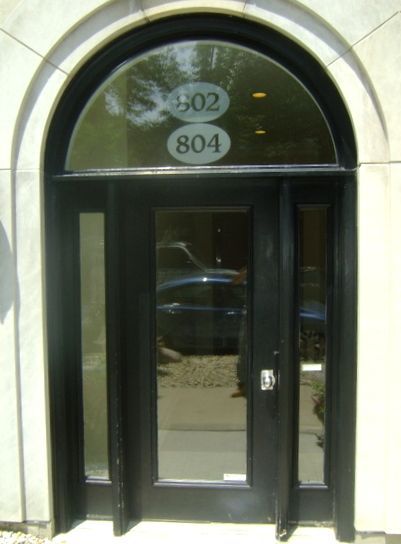 A black door with the numbers 802 and 804 on it