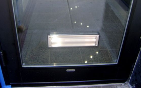 A light is shining through a glass door