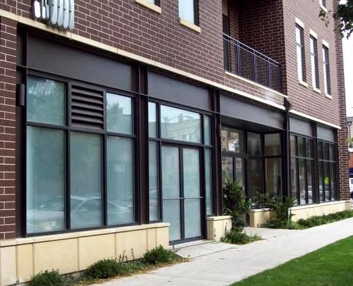 A brick building with lots of windows and a balcony