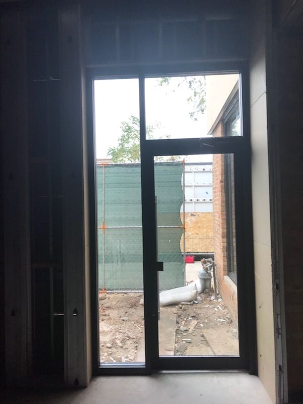 An empty room with a sliding glass door