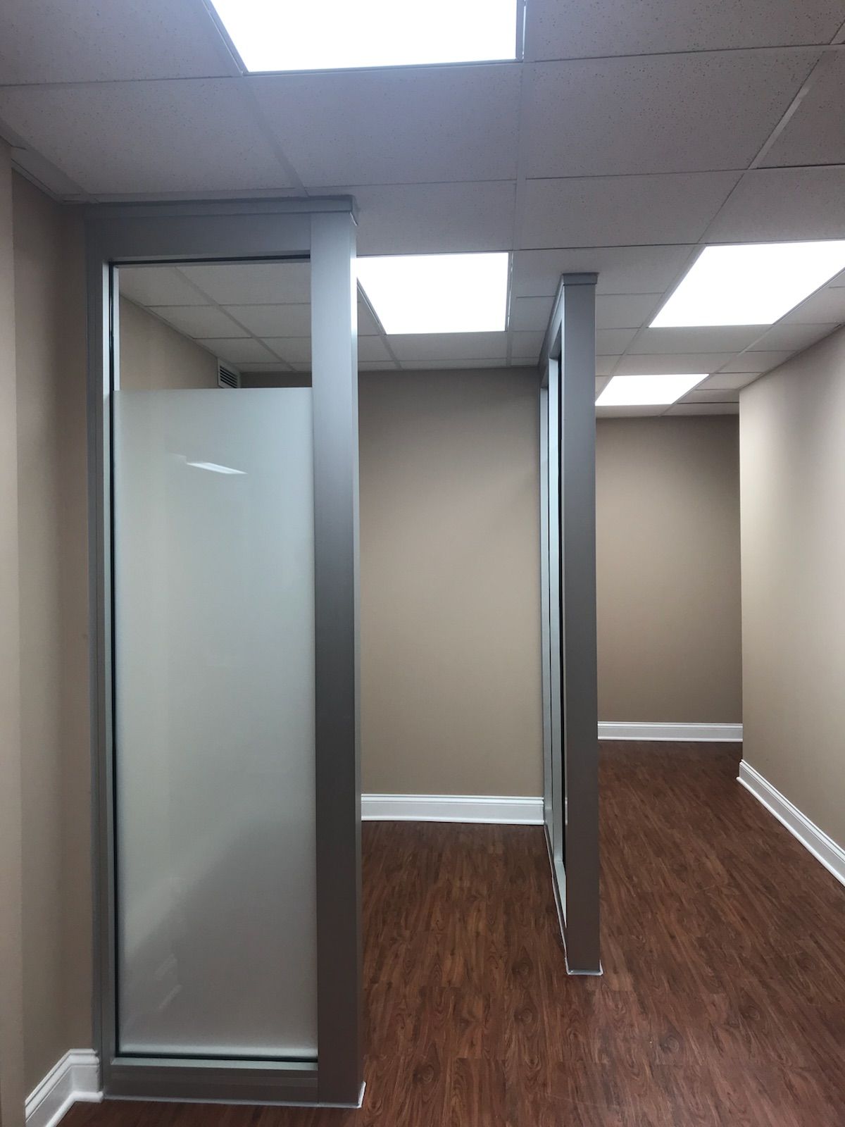 An empty room with a frosted glass door