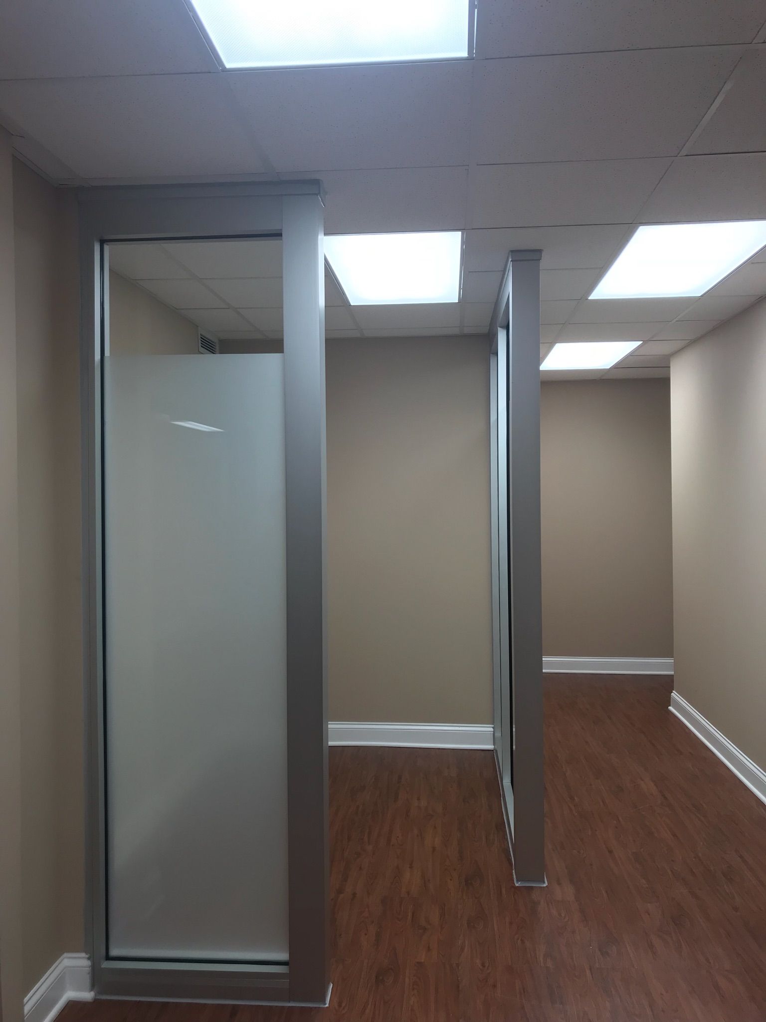 An empty room with a frosted glass door