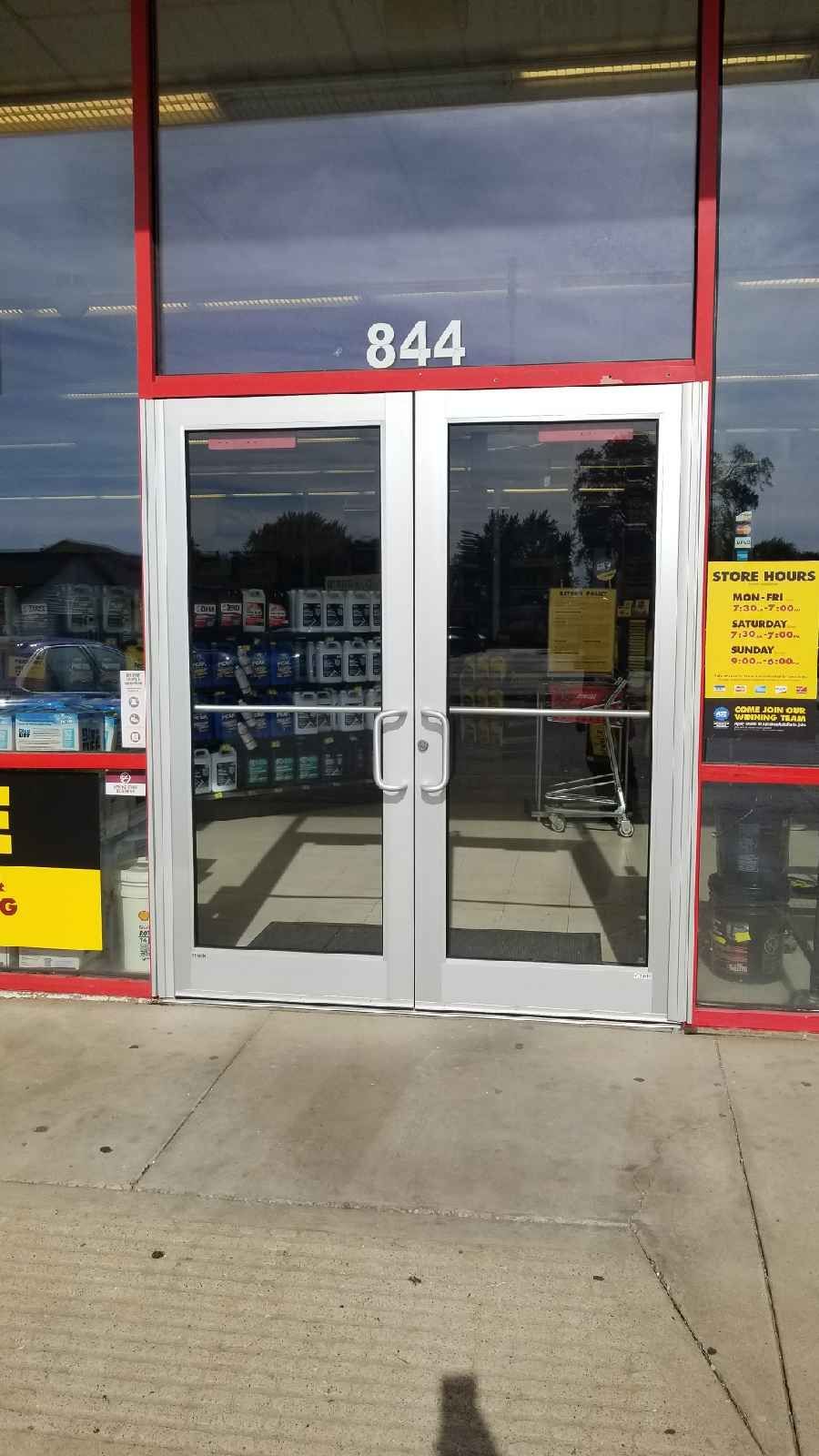 The front door of a store with the number 844 on it.