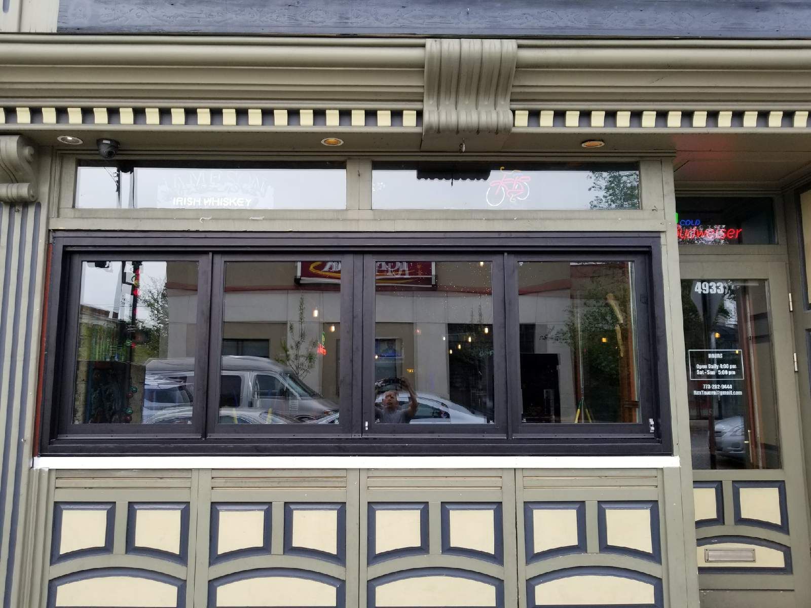 The front of a building with a lot of windows and doors