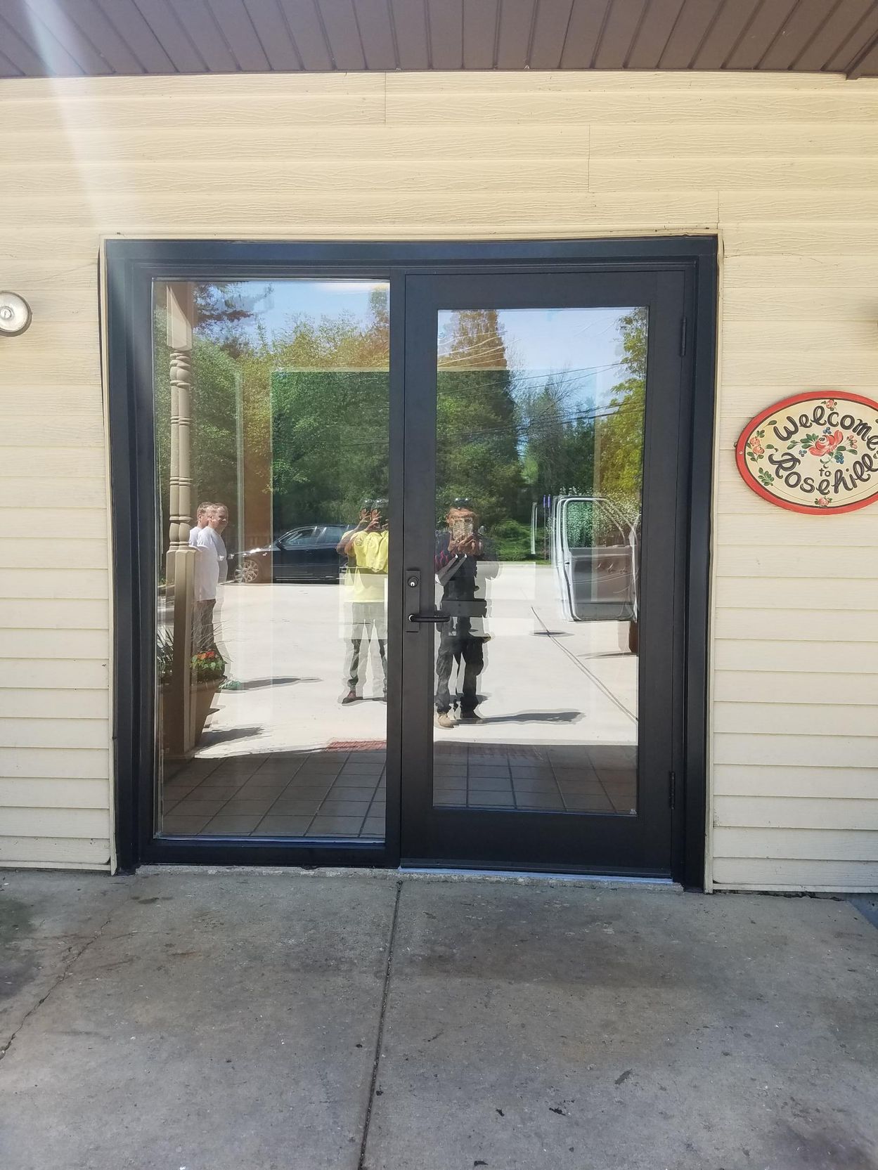 A sign on the side of a building says welcome