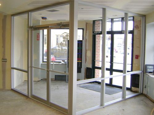 A room with a lot of glass doors and windows