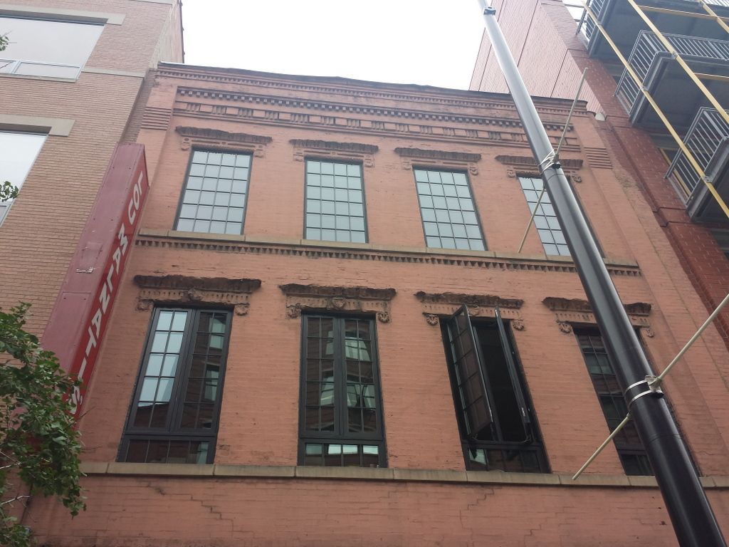 A red brick building with a sign that says ' abercrombie & fitch ' on it
