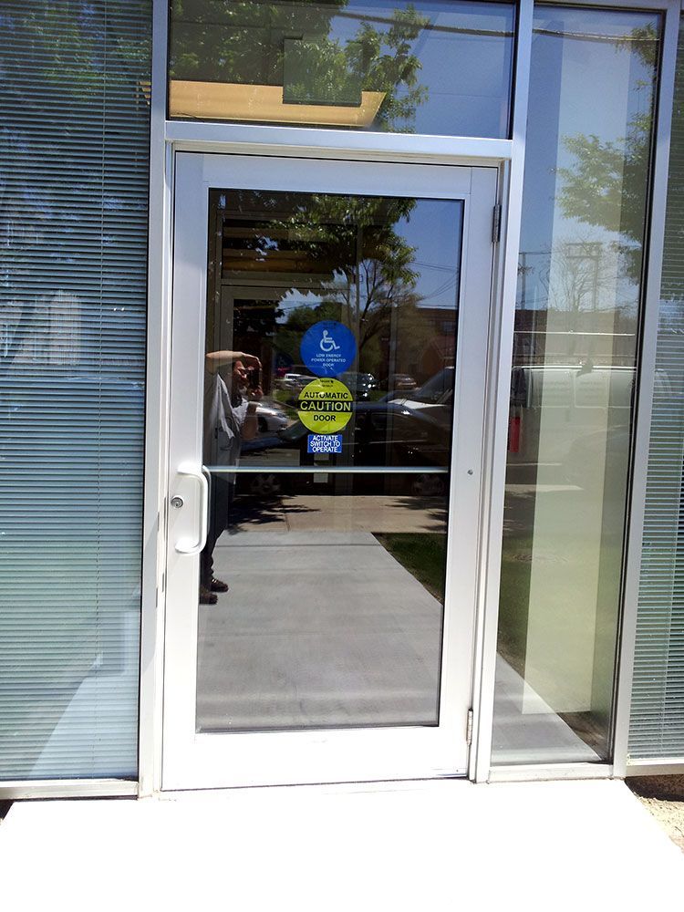 A stainless steel door with a sticker on it that says visa