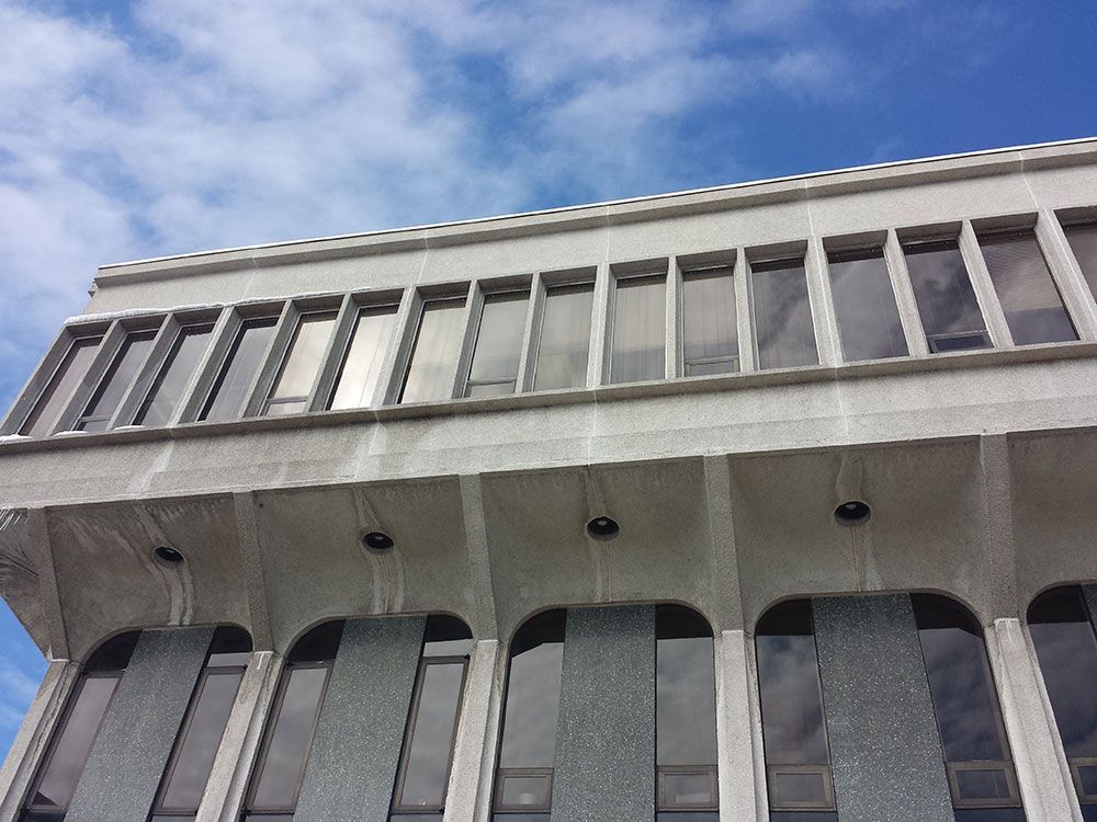 Looking up at a building with a blue sky in the background