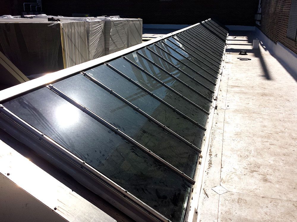 A roof with a lot of skylights on it