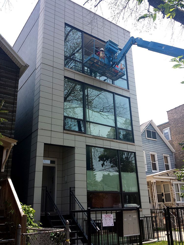 A large building with a crane on top of it