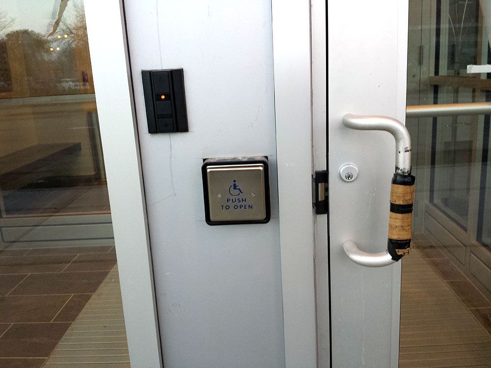 A door with a handicap accessible button on it