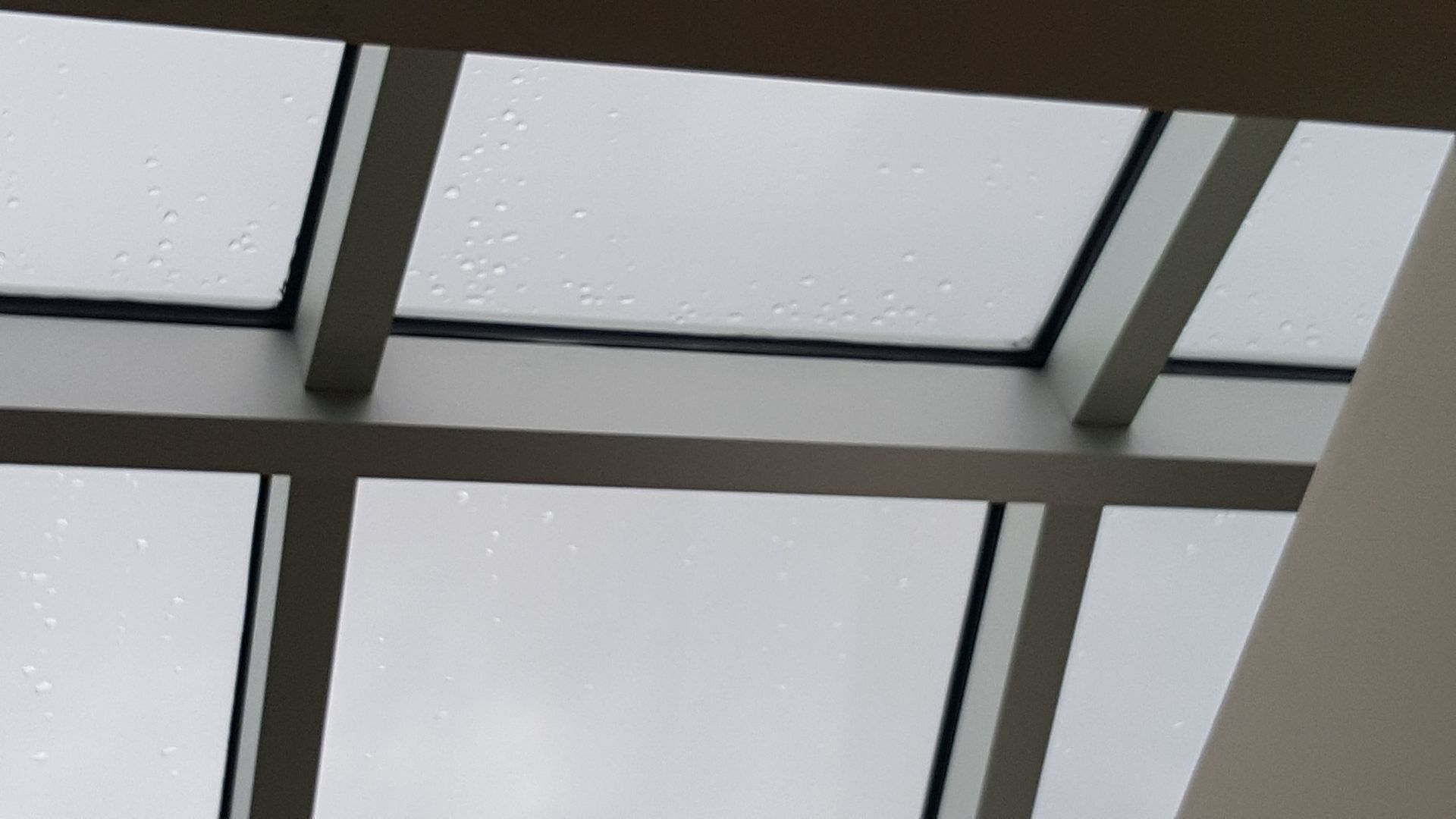A ceiling with a lot of windows and a skylight.