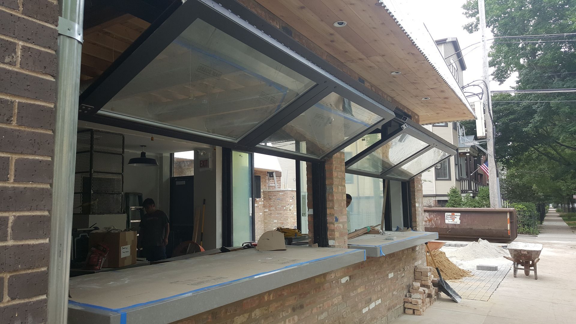 A building with a lot of windows and a brick wall.