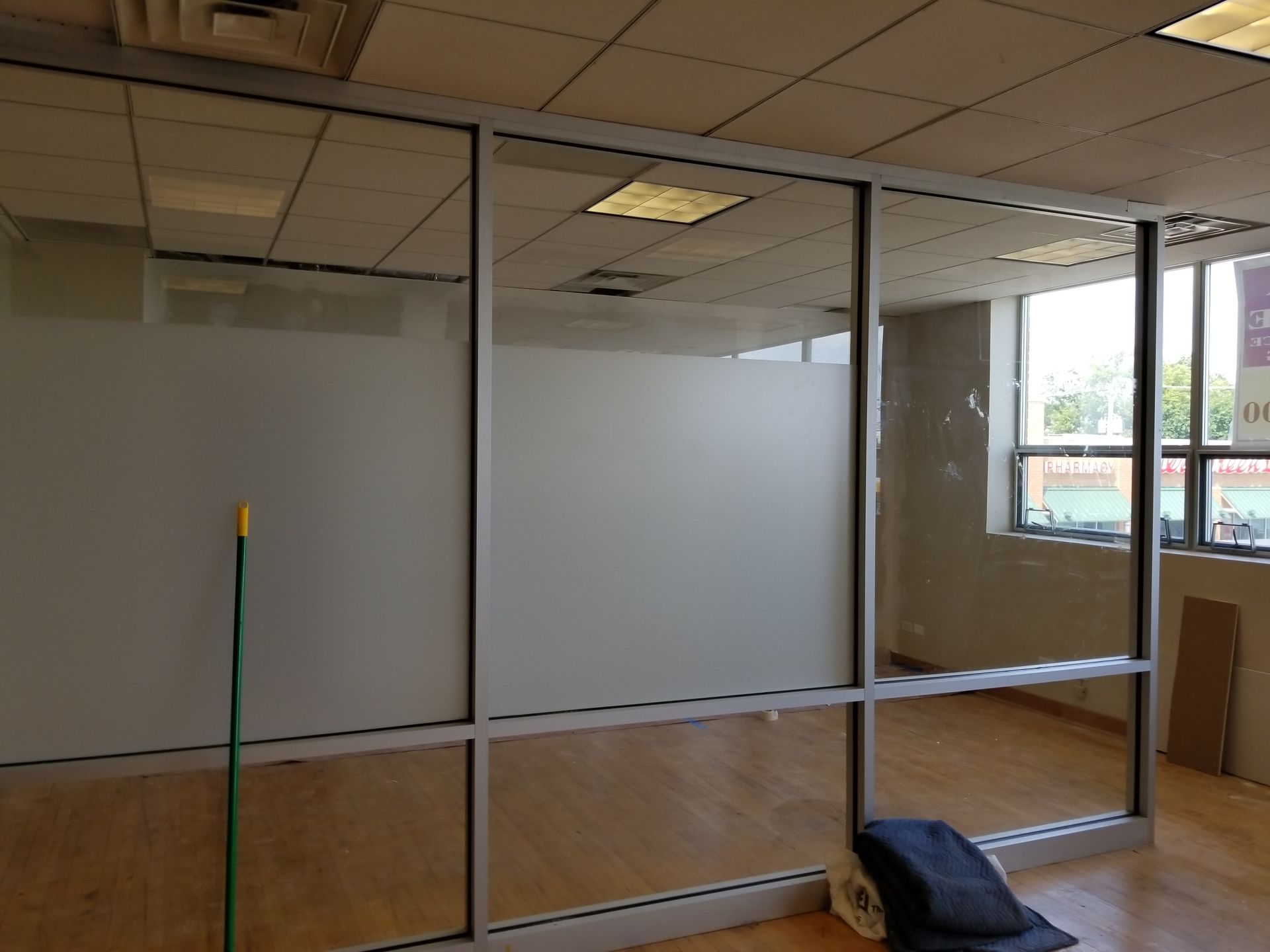A room with a mop and a sign that says ' a ' on it