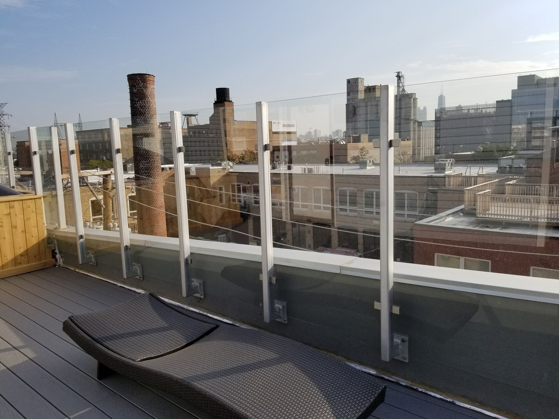 A rooftop deck with a view of a city