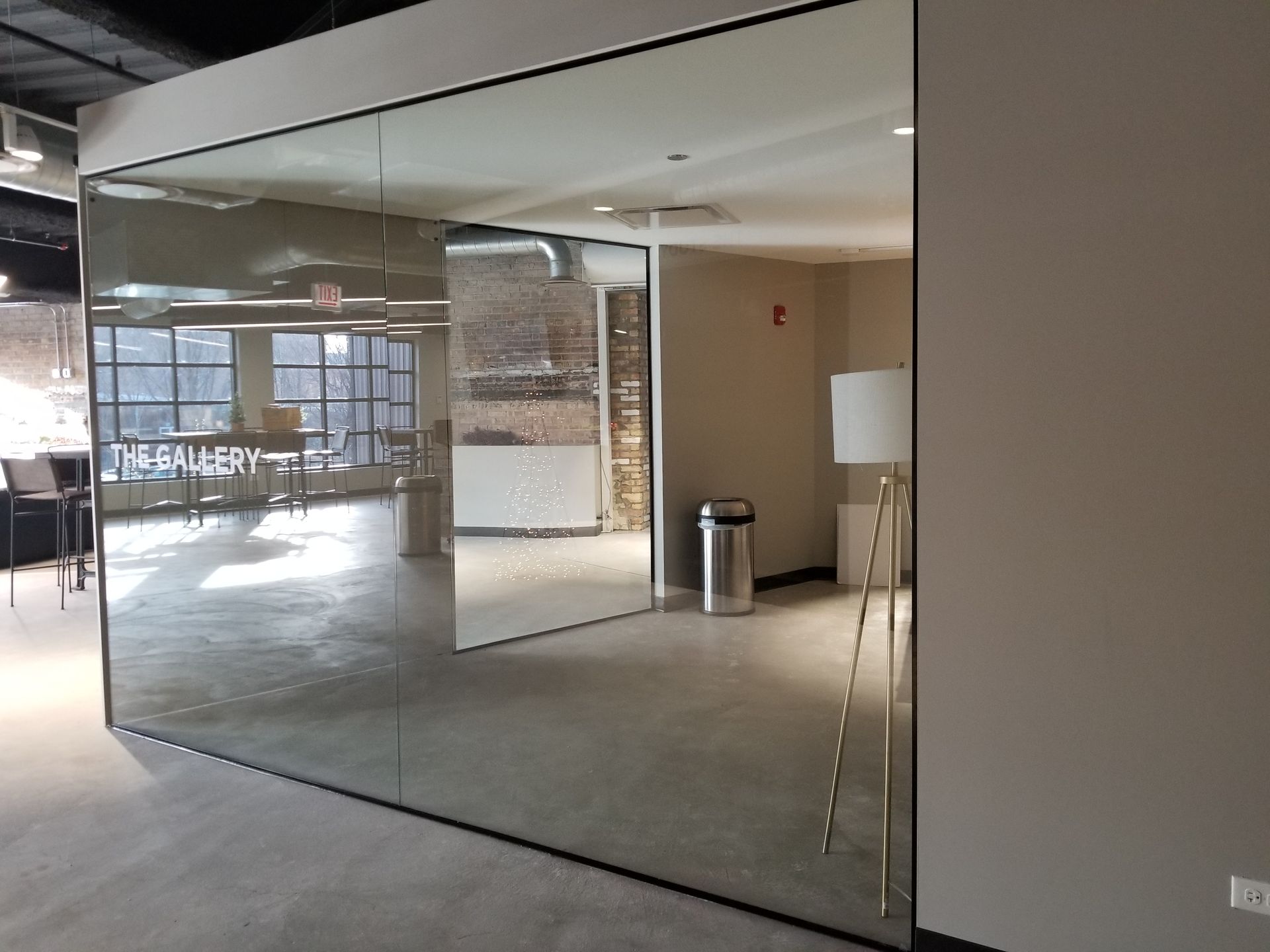 A room with a large mirror on the wall