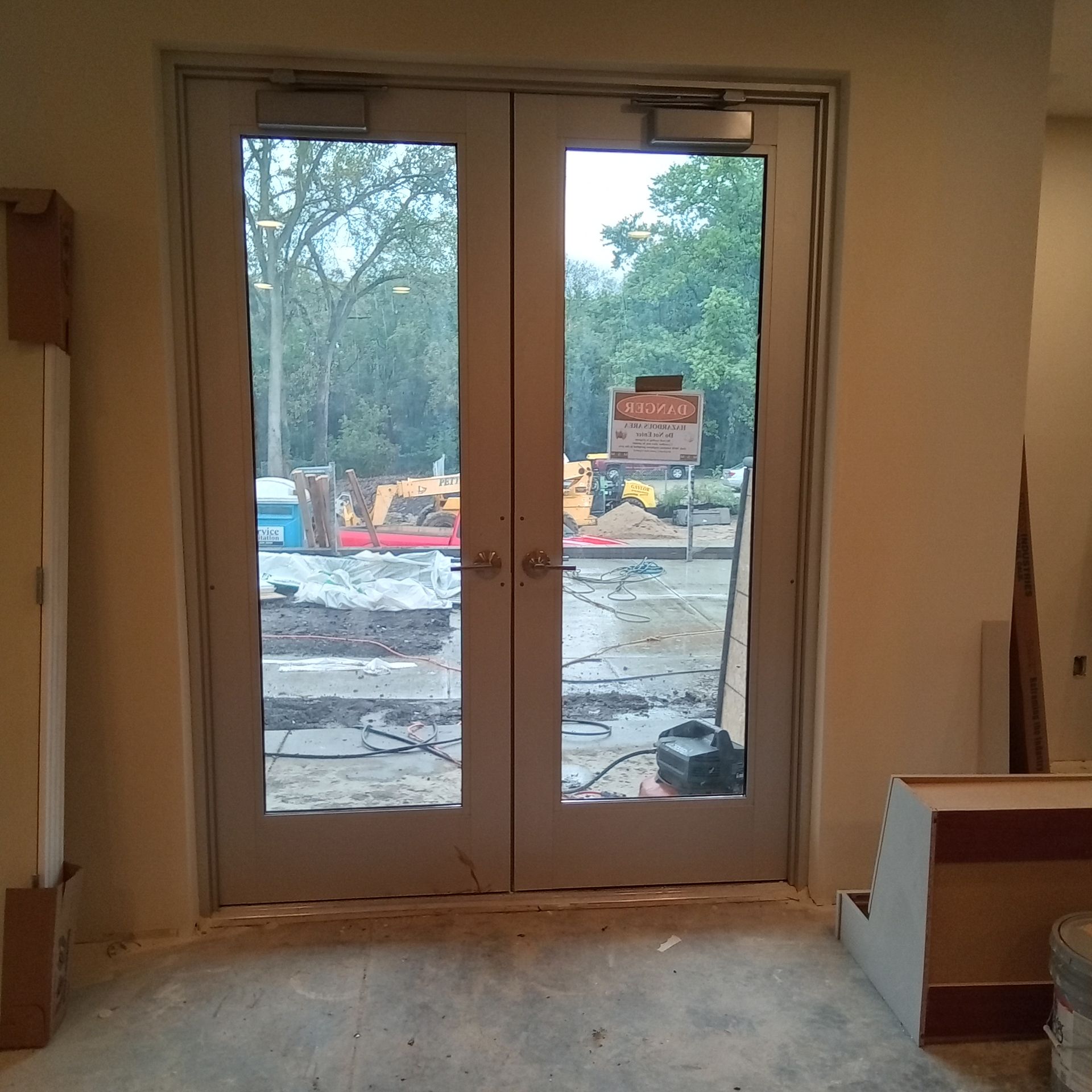 A building under construction with a sign that says no parking