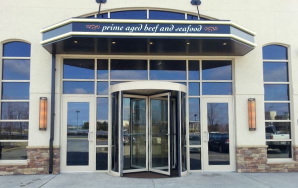 The entrance to a restaurant called prime aged beef and seafood