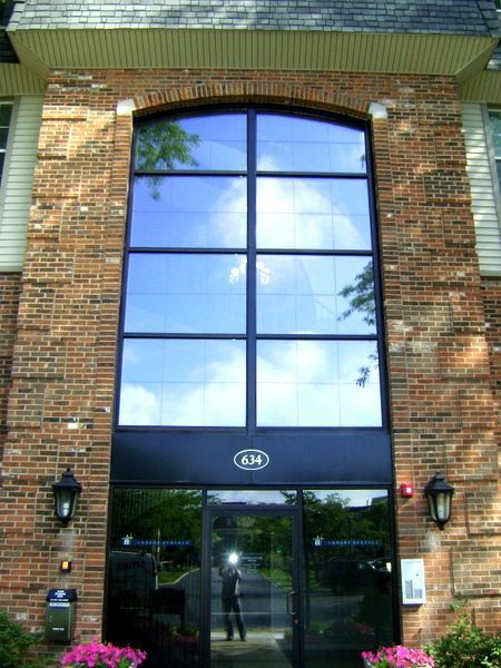 A brick building with the number 64 on it