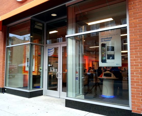 A store front with a sign that says download to router