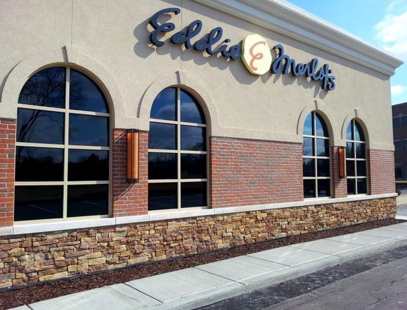 A ellie 's emeralds restaurant with arched windows