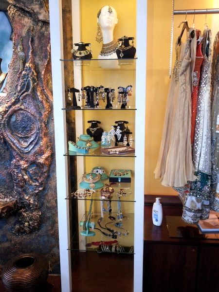 A display case with a lot of jewelry on it