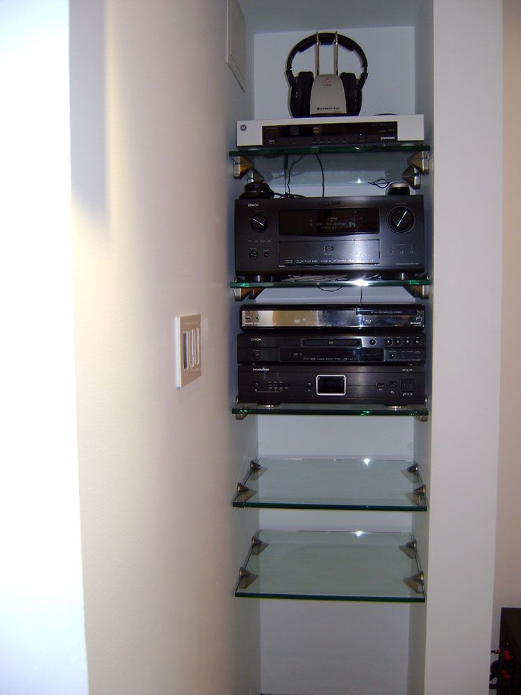 A shelf with a bunch of electronics on it