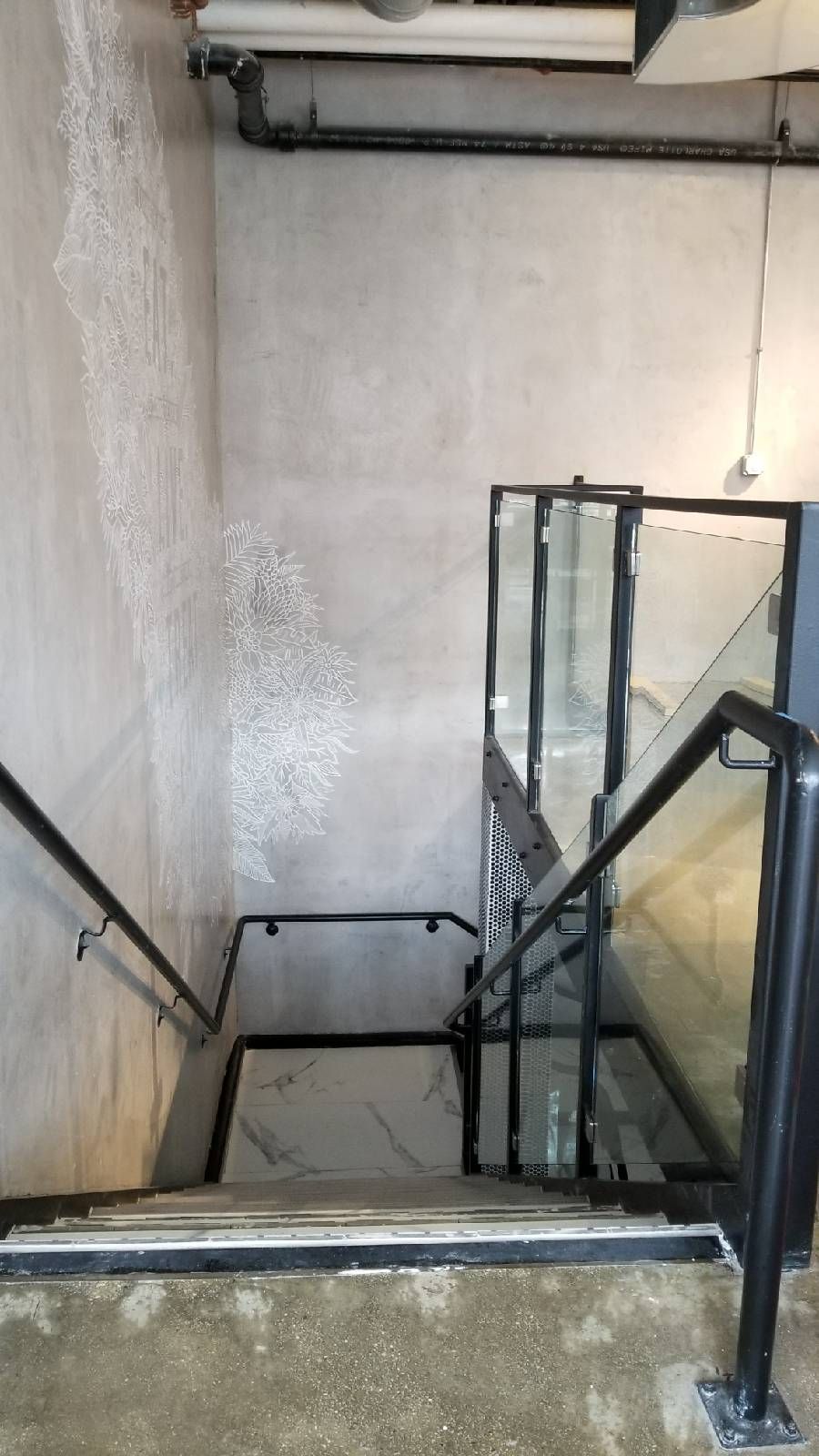 A set of stairs leading up to a second floor in a building.