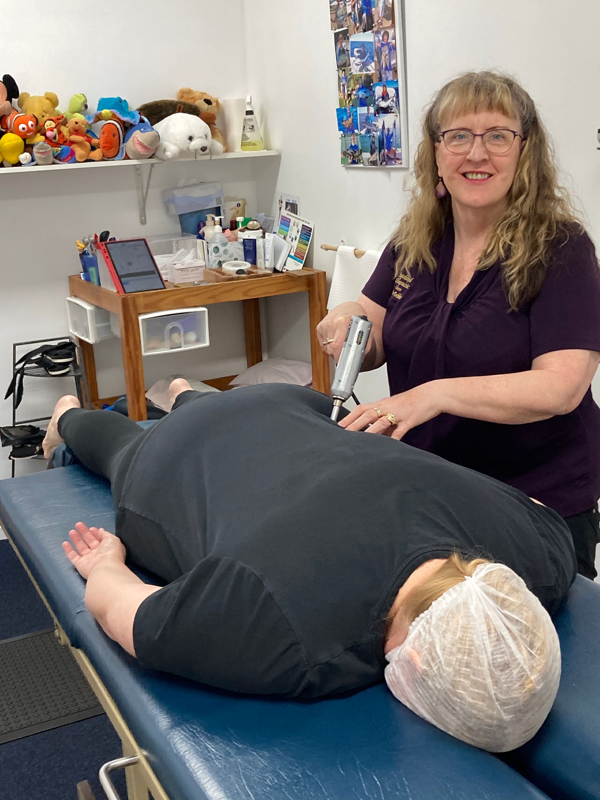 A Woman is Getting a Massage at a Spa — Sugarland Chiropractic Centre in Avoca, QLD