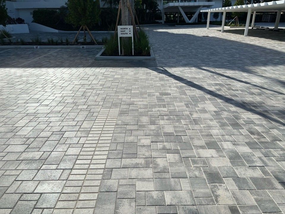 Gray paver brick driveway and parking lot.
