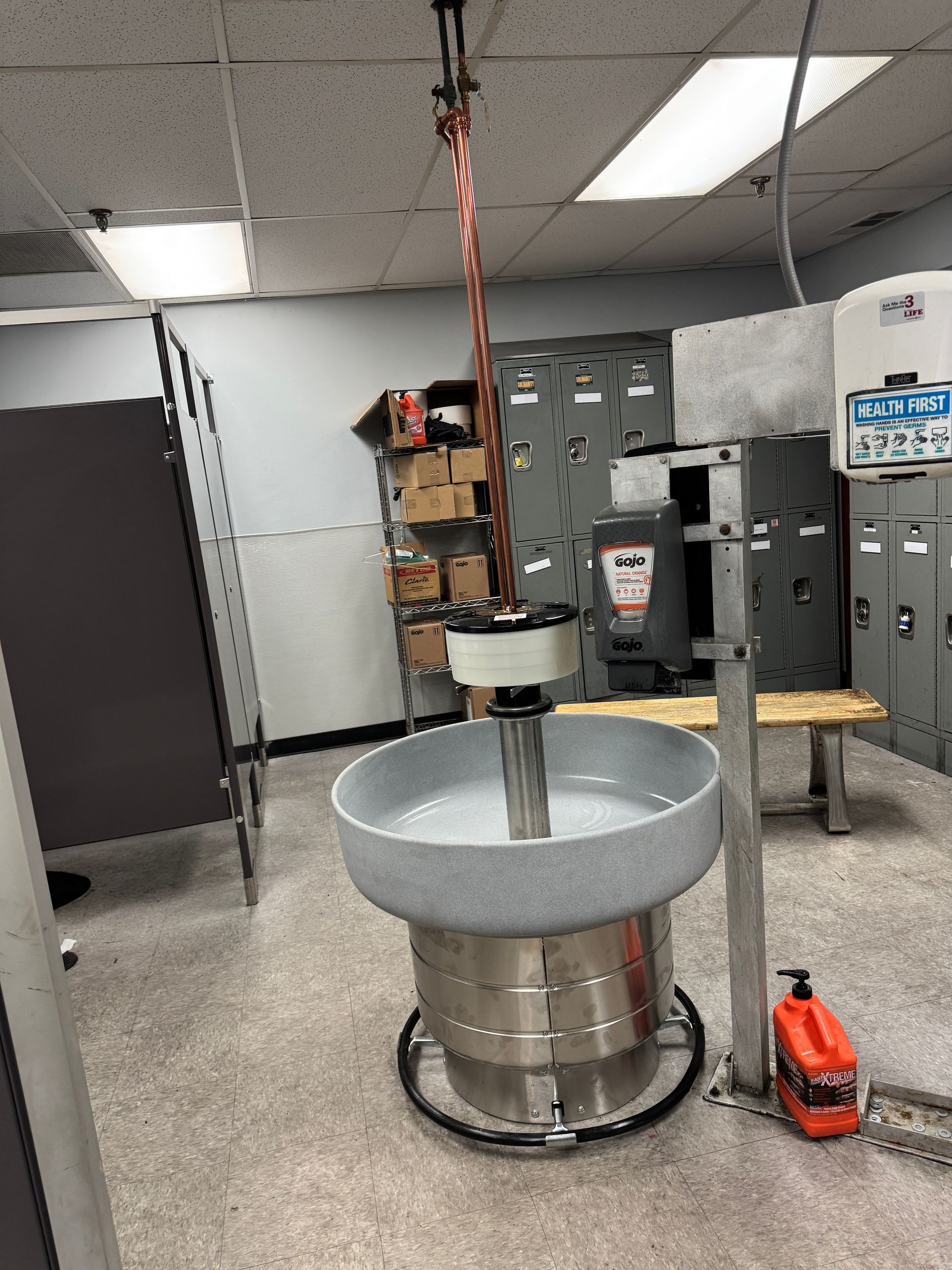 Calhoun Plumbing Services LLC | A bathroom with a sink and a sign that says safety