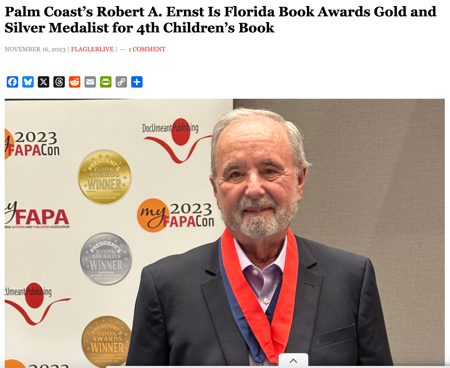 Robert A. Ernst, in Palm Coast, poses with Florida Book Award medals at FAPACon.