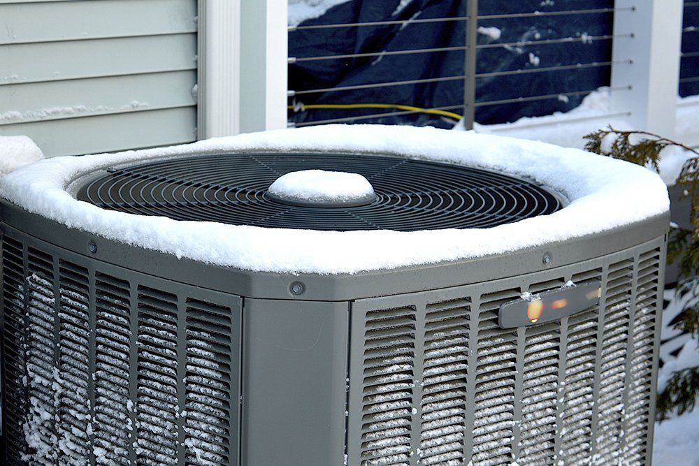 Snow-Covered Outdoor AC Unit