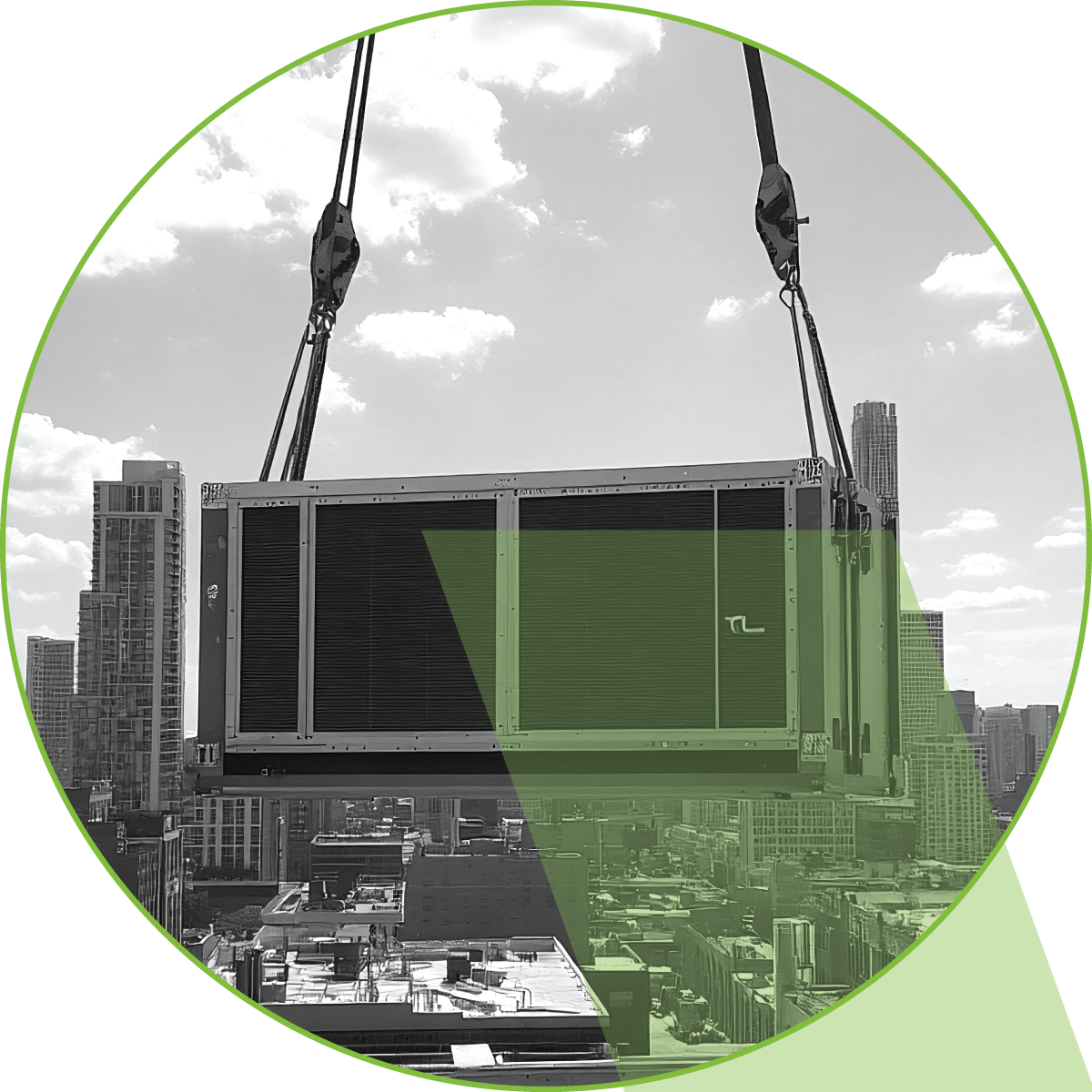 A crane is lifting a large piece of equipment in a green circle