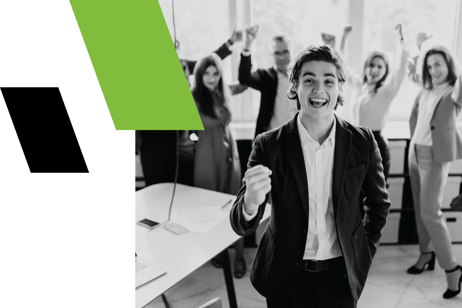 A man in a suit is standing in front of a group of people with their arms in the air.