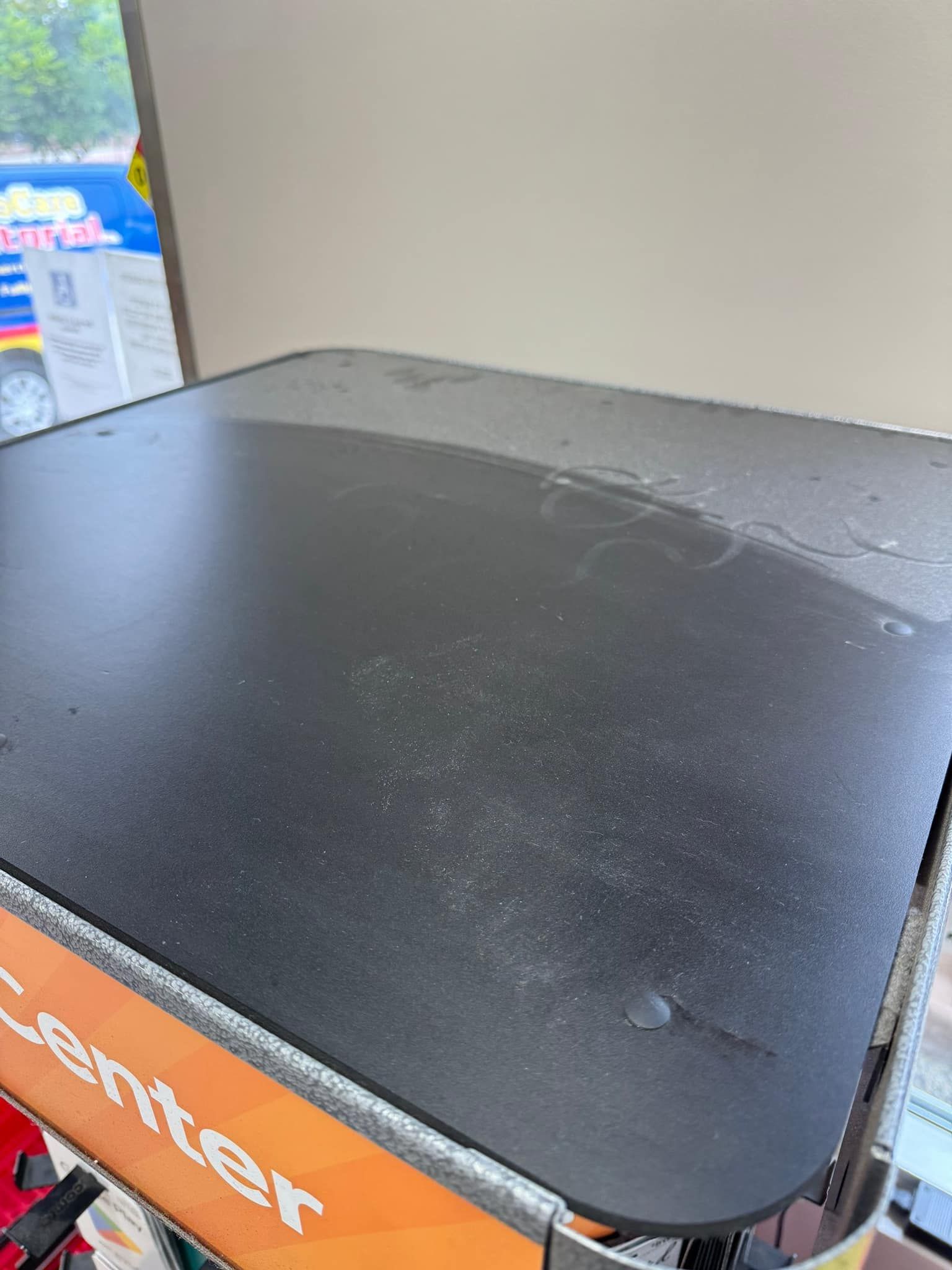 A black and orange item with the word center on it