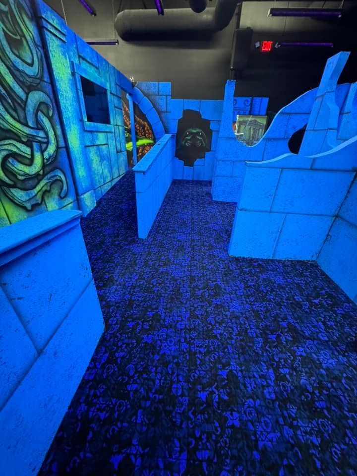 A room with blue walls and a blue carpet.