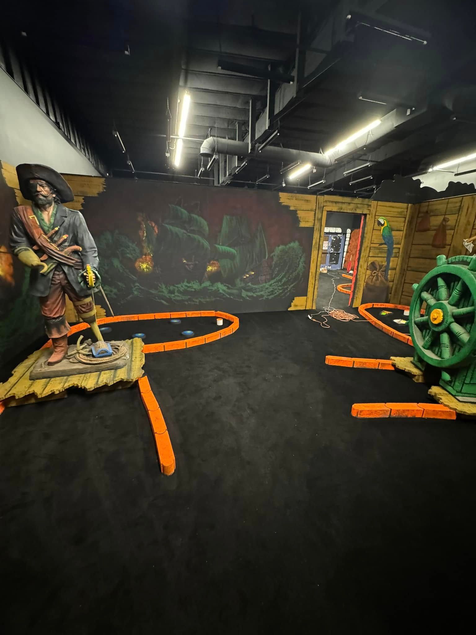 There is a pirate statue in the middle of the room.